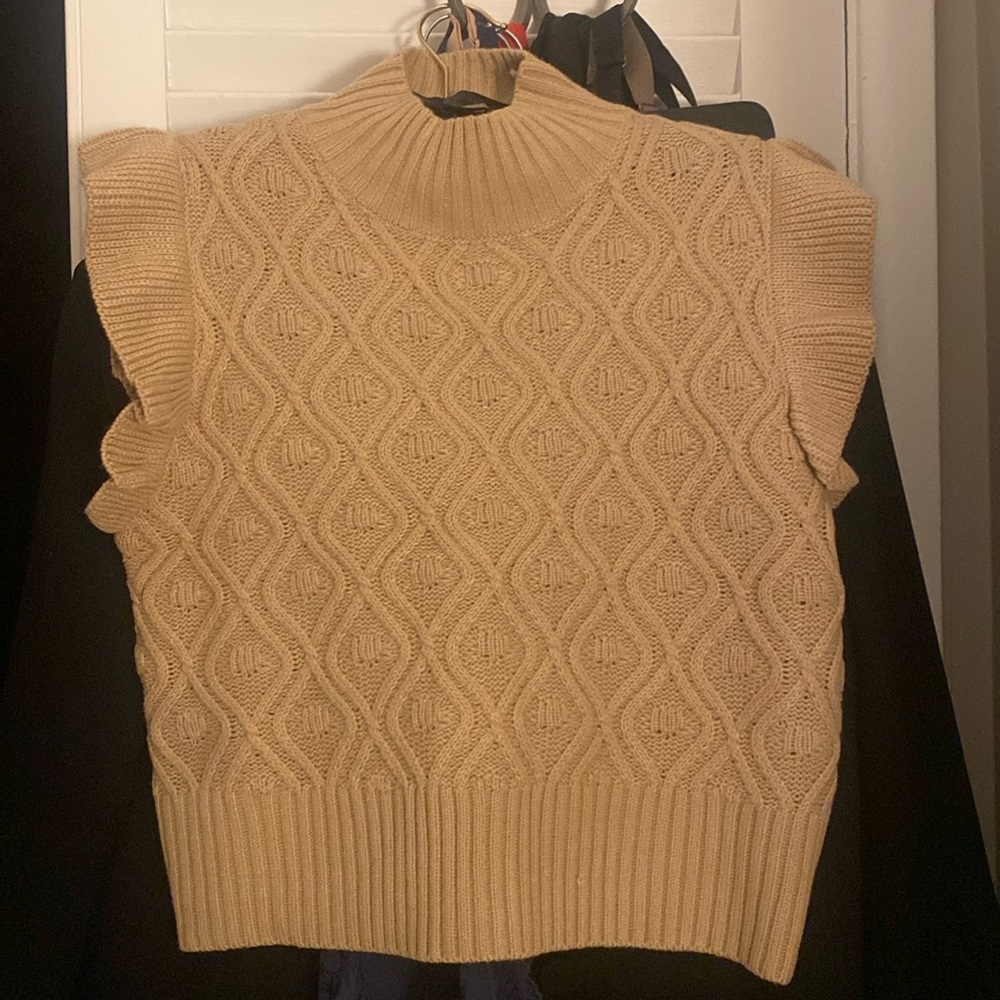 Tan vest one size fits a medium.